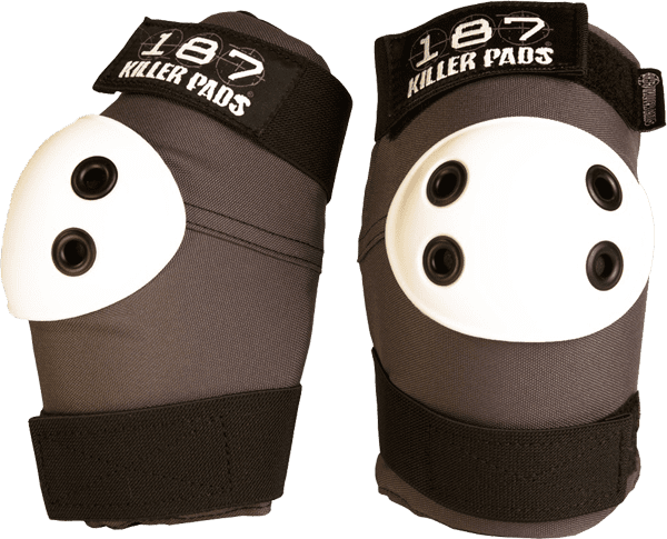 187 Standard Elbow Pad in dark grey color on a skateboarder's arm at a skatepark