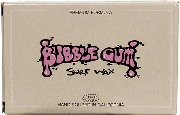 Bubble Gum Premium Blend Cold Single Bar surf wax bar on a black surfboard deck