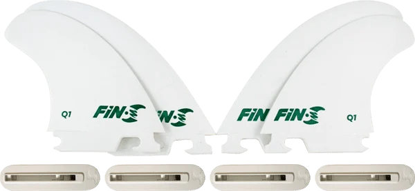 Four white FIN-S Production Set Q-1 Quad surfboard fins in box